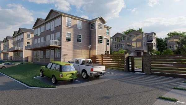 a car parked in front of a brick house