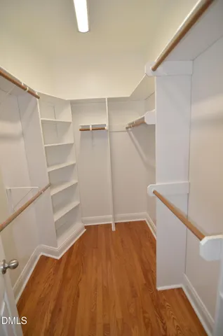 a bathroom with a tub and a toilet