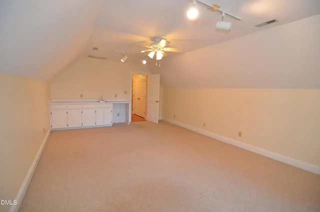 a view of a house with a yard and tree s