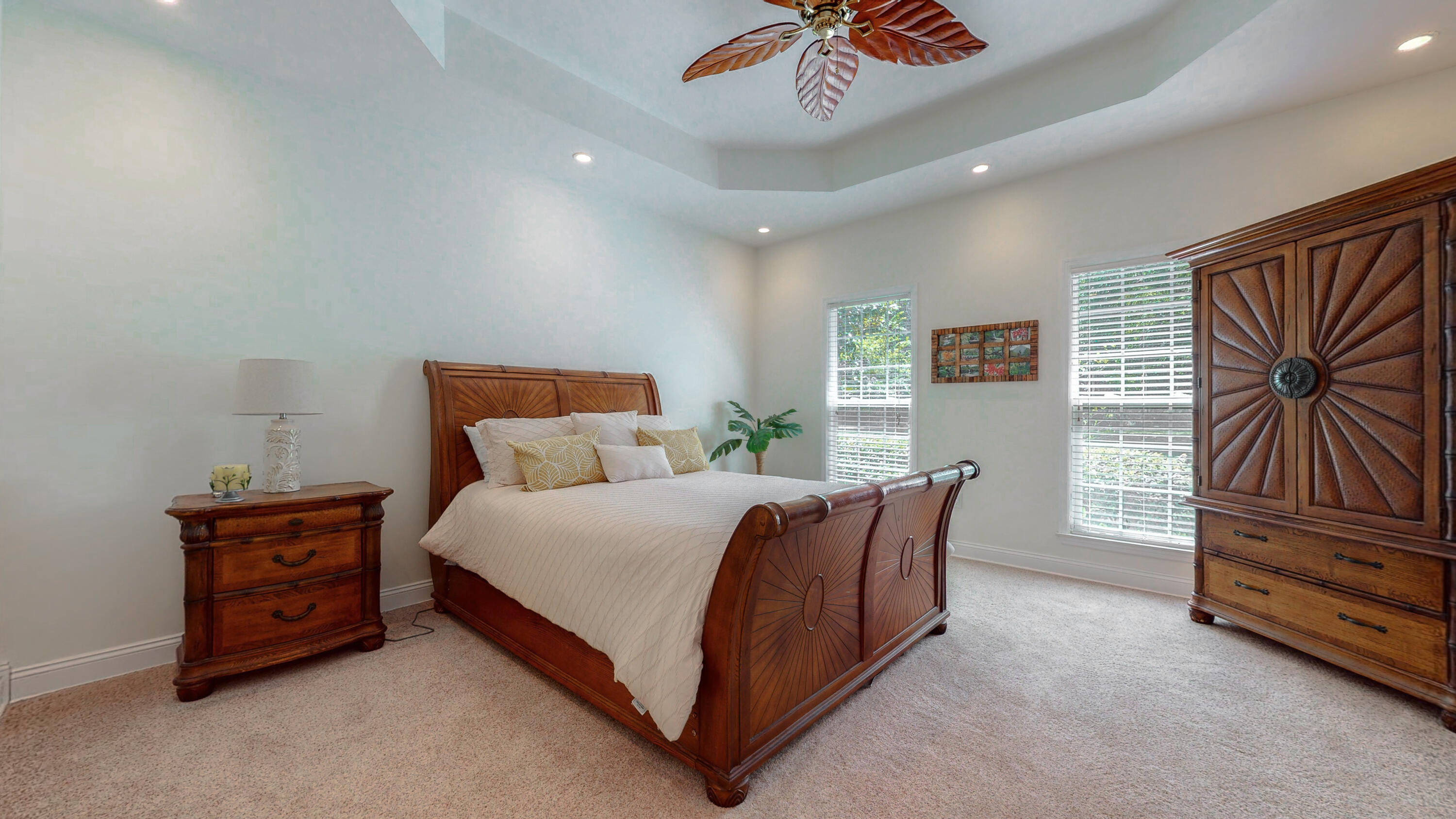 83 Launch Road DeFuniak Springs, FL 32433 - Photo 25 of 62 a spacious bedroom with a bed and a chandelier