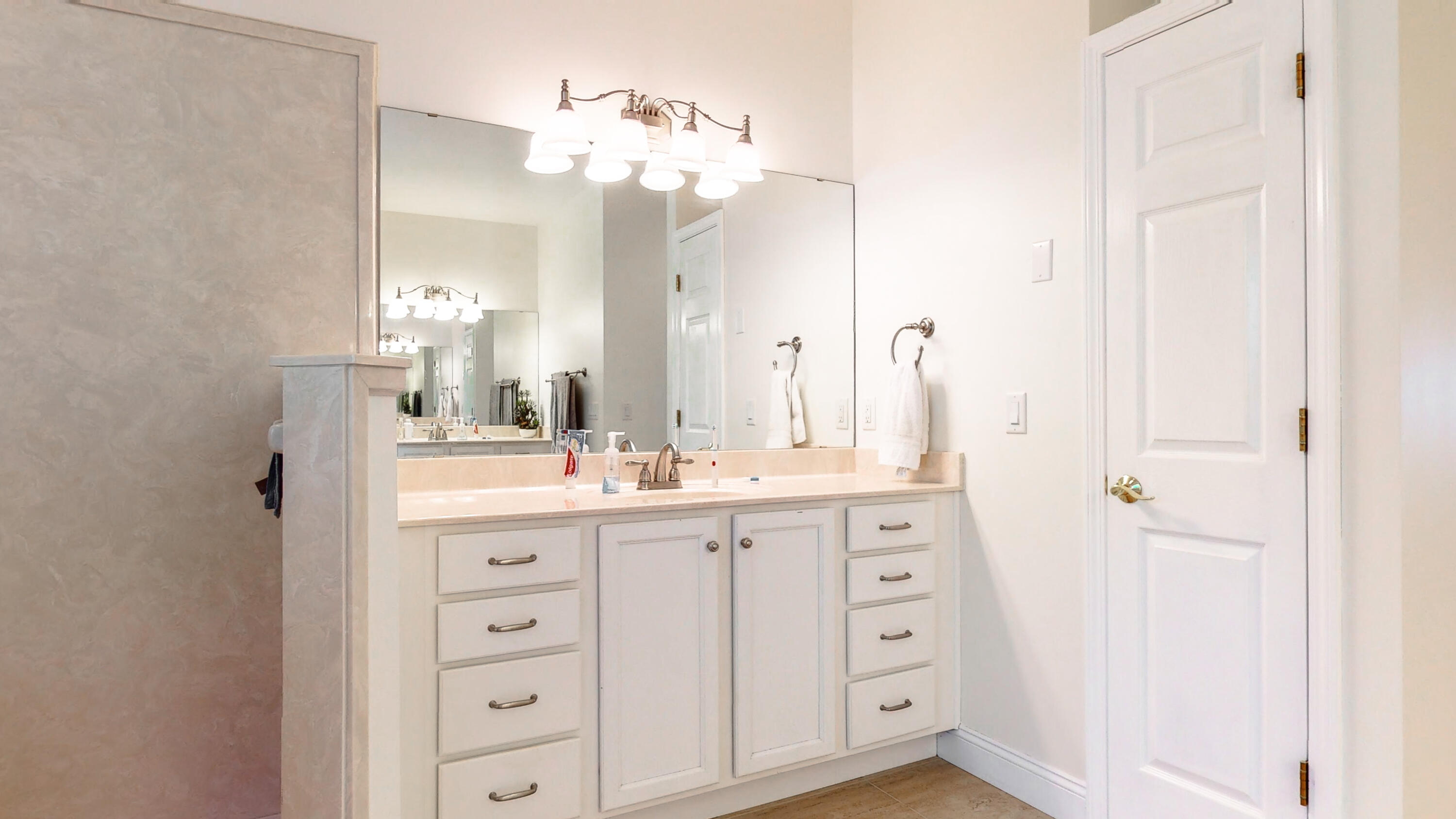 83 Launch Road DeFuniak Springs, FL 32433 - Photo 32 of 62 a bathroom with a double vanity sink and mirror