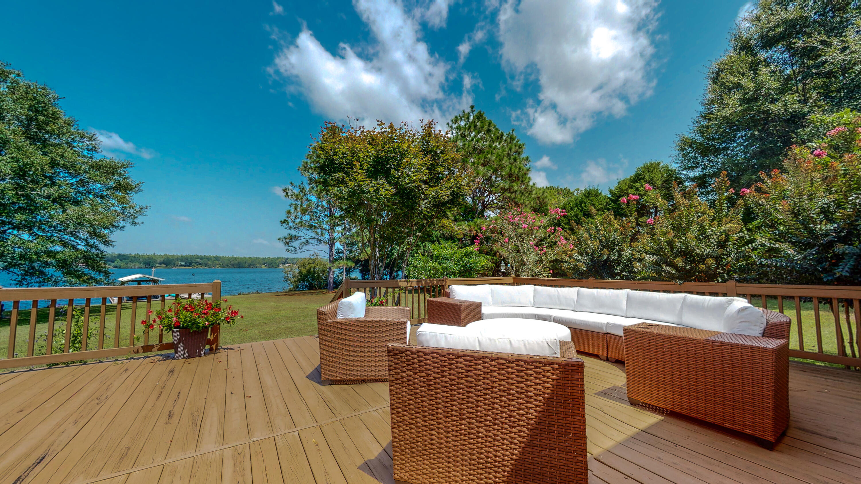 83 Launch Road DeFuniak Springs, FL 32433 - Photo 35 of 62 a view of a chairs and table on the wooden deck