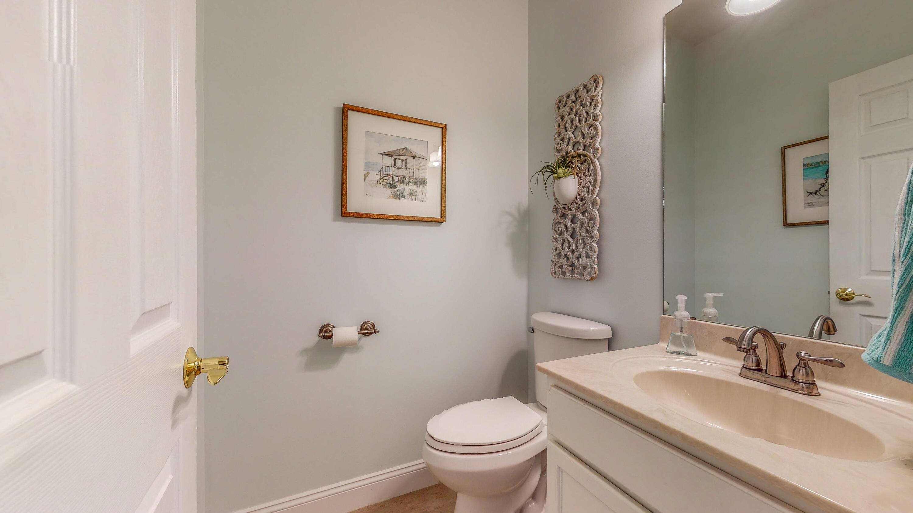 83 Launch Road DeFuniak Springs, FL 32433 - Photo 41 of 62 a bathroom with a sink toilet and a mirror