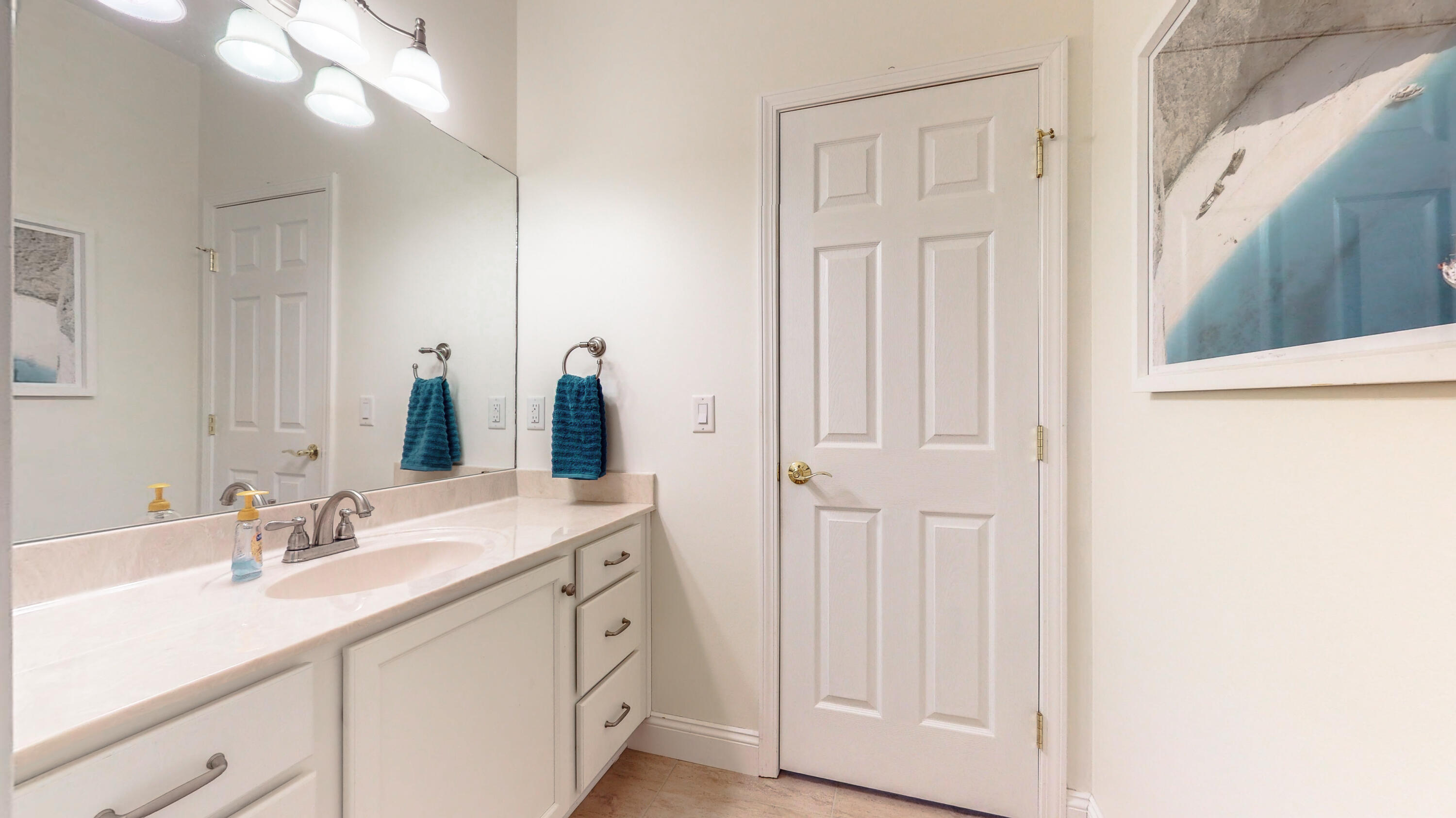 83 Launch Road DeFuniak Springs, FL 32433 - Photo 43 of 62 a bathroom with a double vanity sink and a mirror