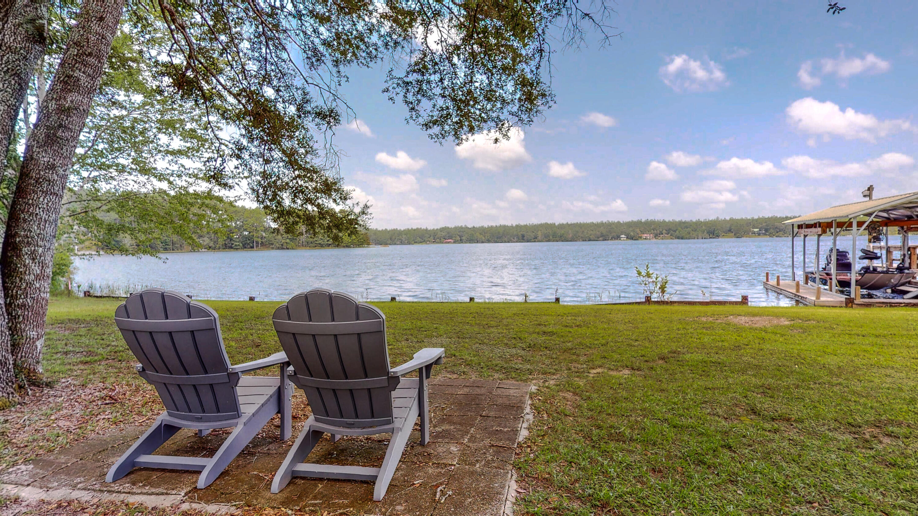 83 Launch Road DeFuniak Springs, FL 32433 - Photo 52 of 62 a view of a chairs and table on the terrace