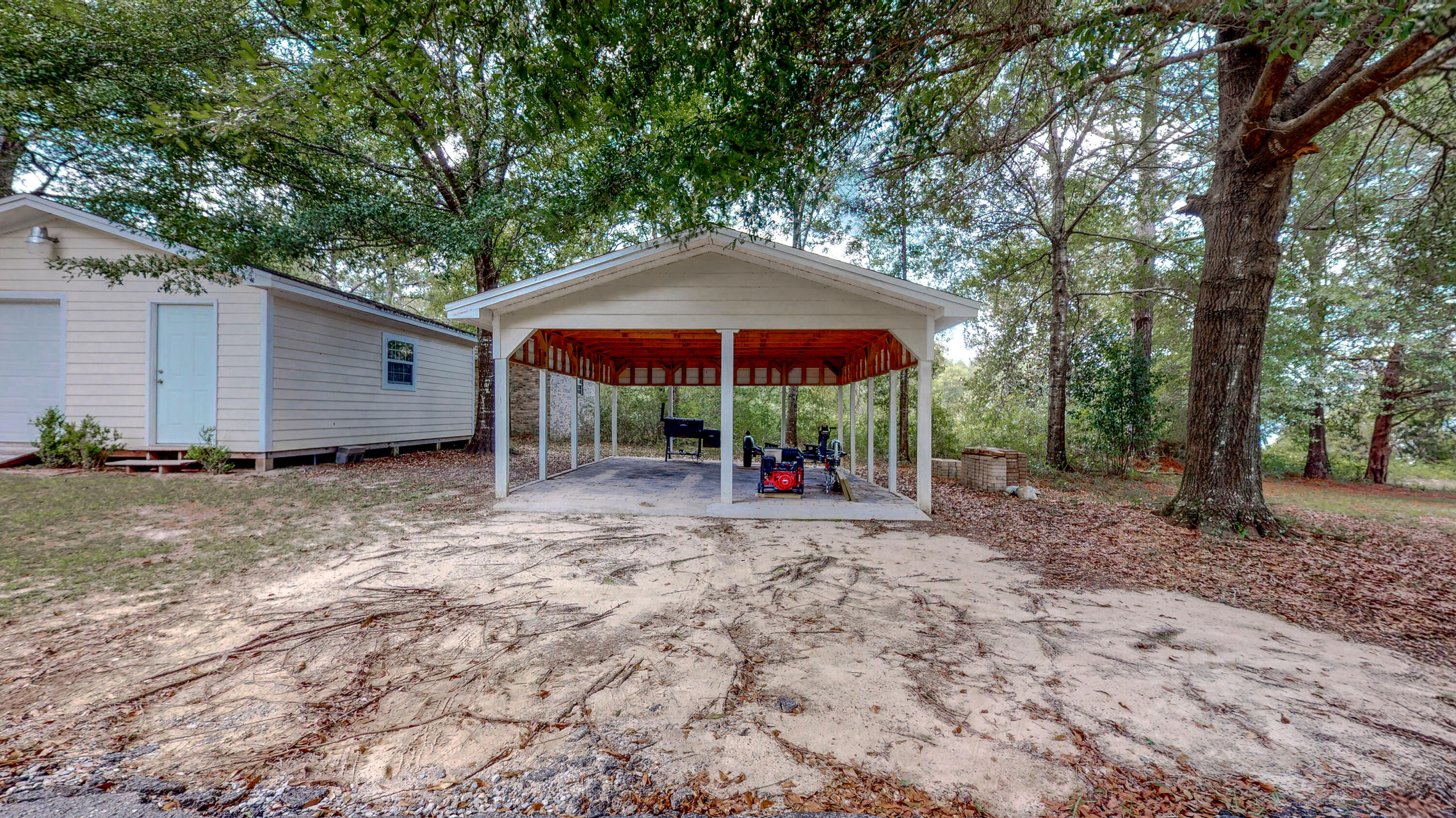 83 Launch Road DeFuniak Springs, FL 32433 - Photo 53 of 62 a view of a house with a yard and sitting area