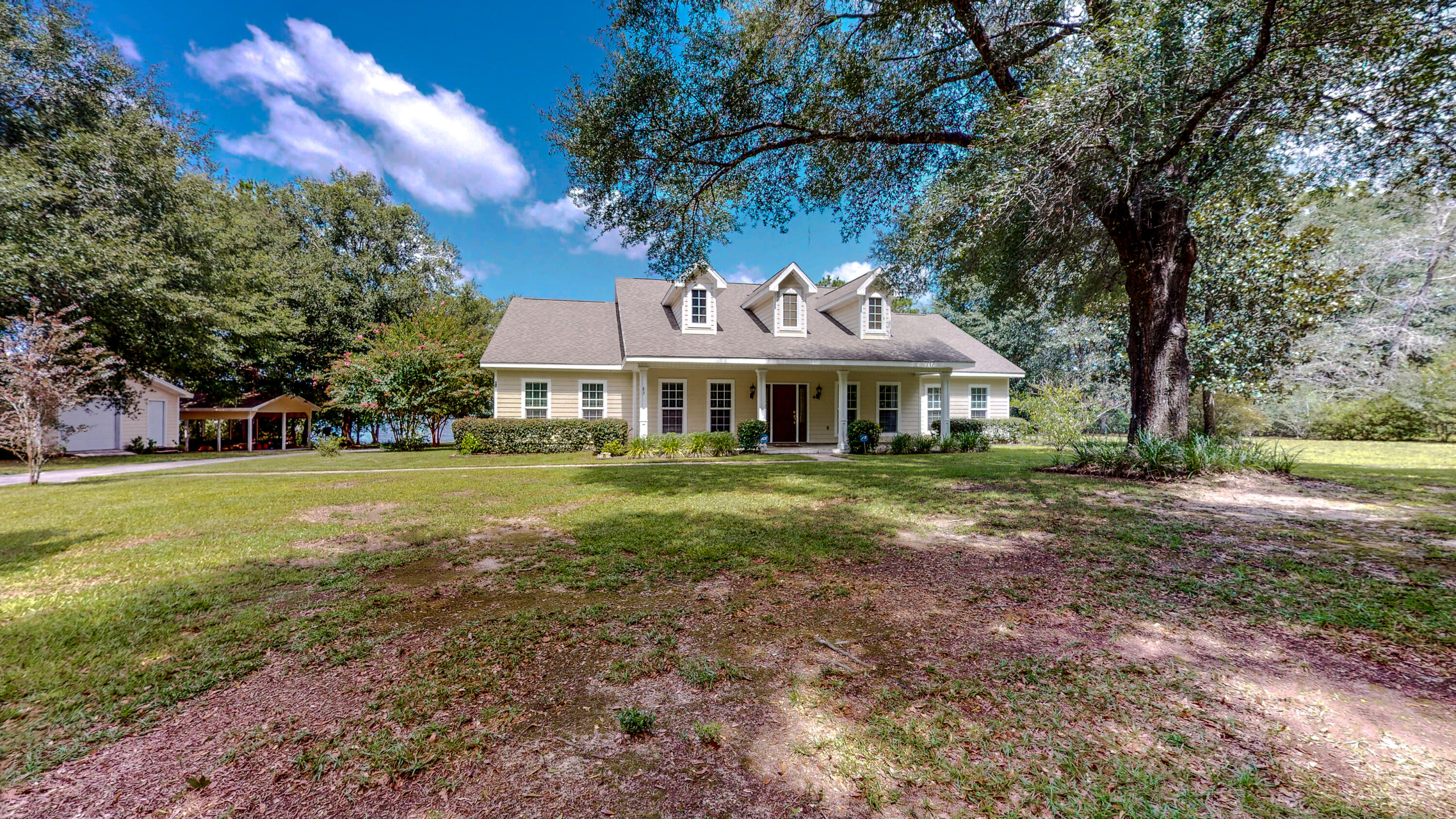 83 Launch Road DeFuniak Springs, FL 32433 - Photo 57 of 62 a front view of a house with a yard