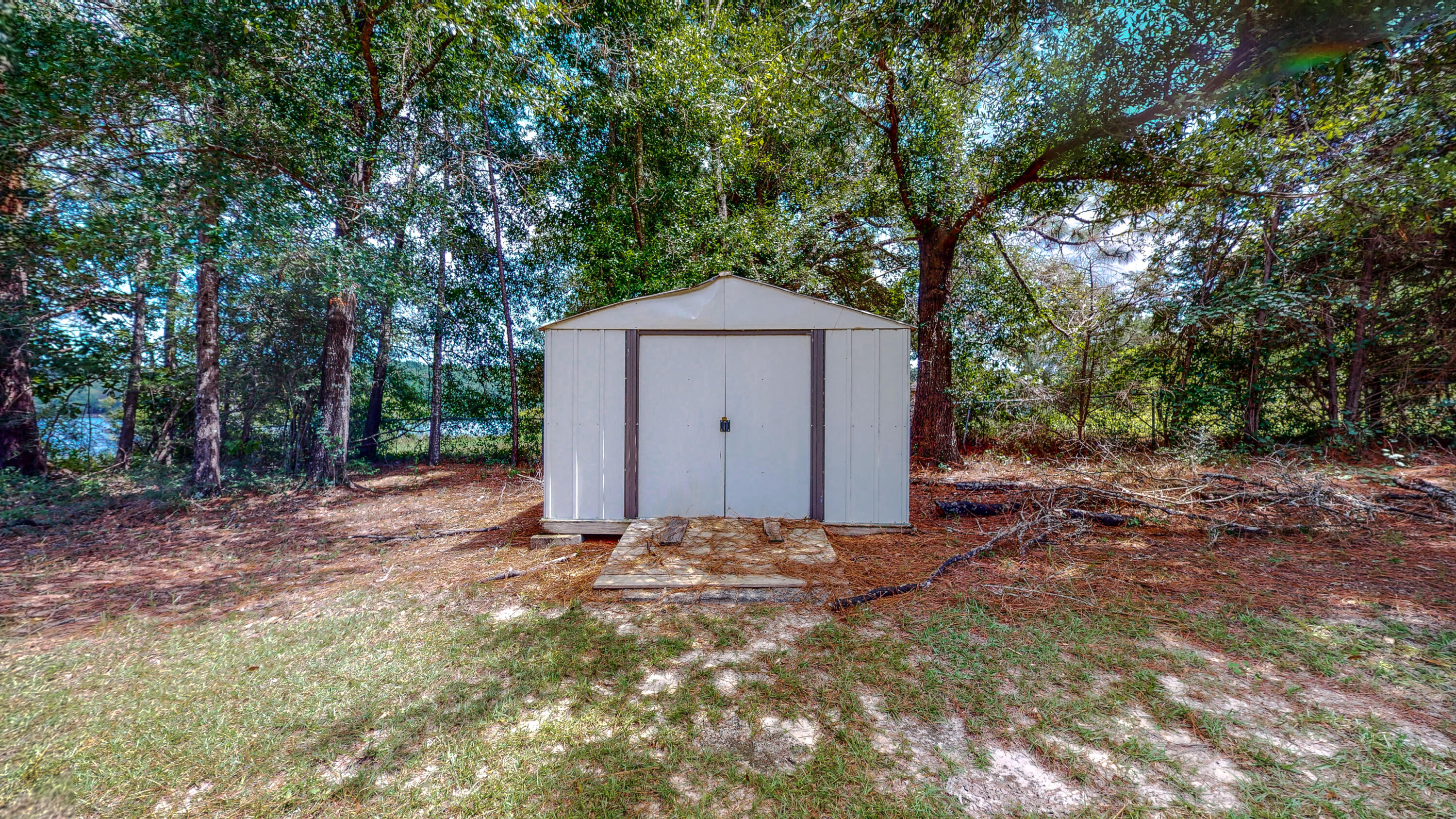 83 Launch Road DeFuniak Springs, FL 32433 - Photo 59 of 62 a front view of a house with a yard and garage