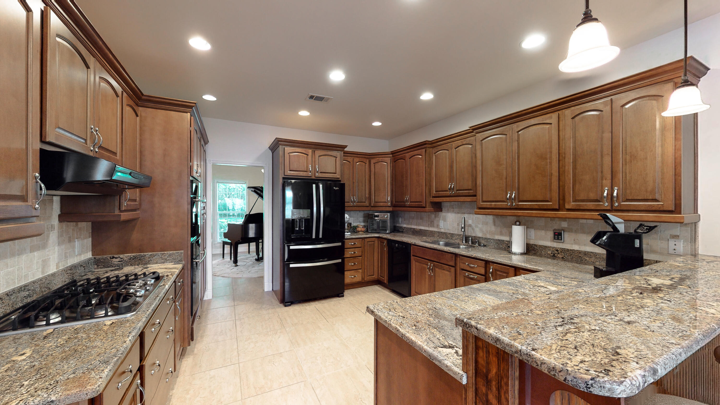 83 Launch Road DeFuniak Springs, FL 32433 - Photo 60 of 62 a kitchen with stainless steel appliances granite countertop a refrigerator stove and sink