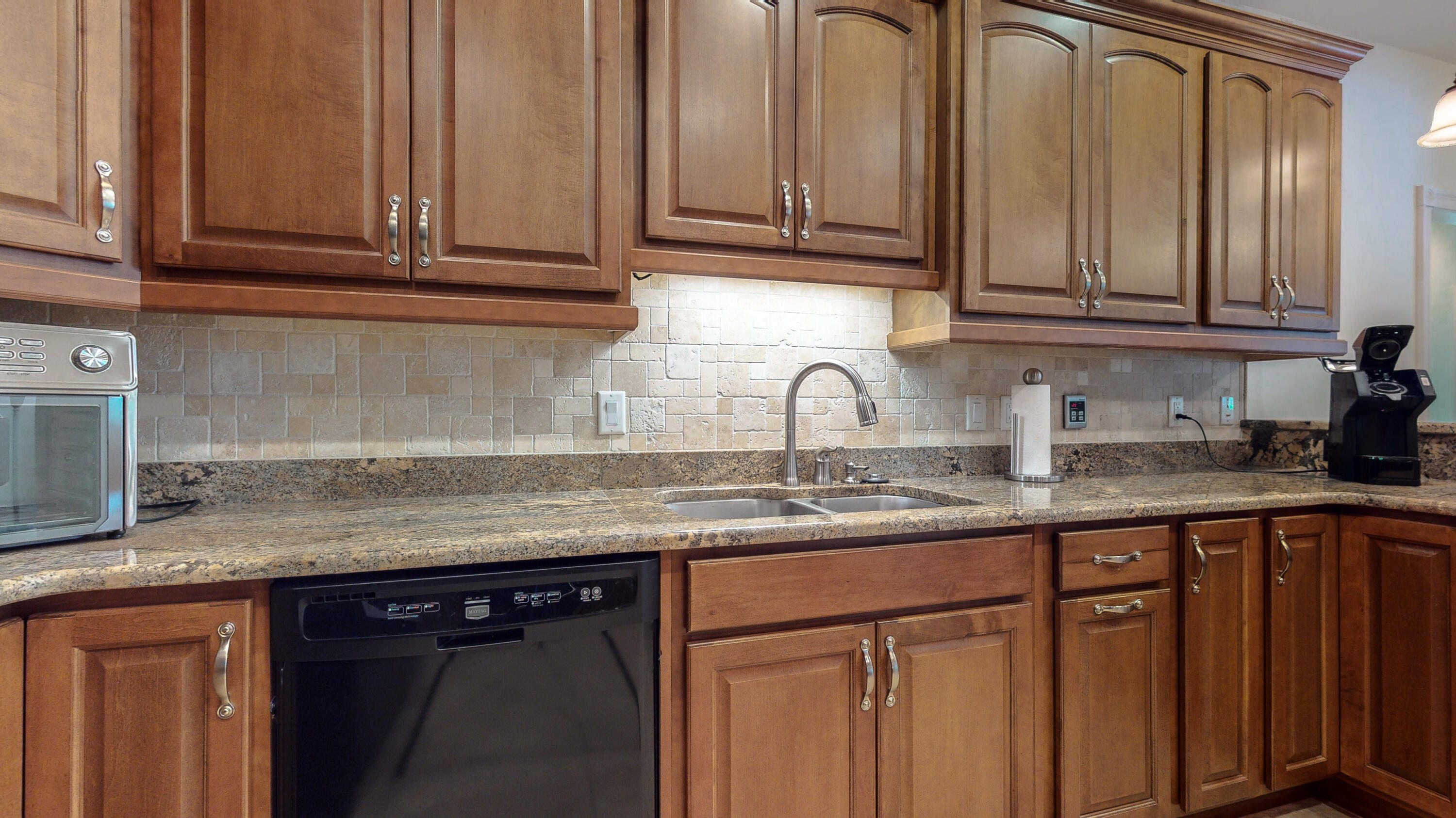 83 Launch Road DeFuniak Springs, FL 32433 - Photo 7 of 62 a kitchen with granite countertop stainless steel appliances white cabinets sink and dishwasher