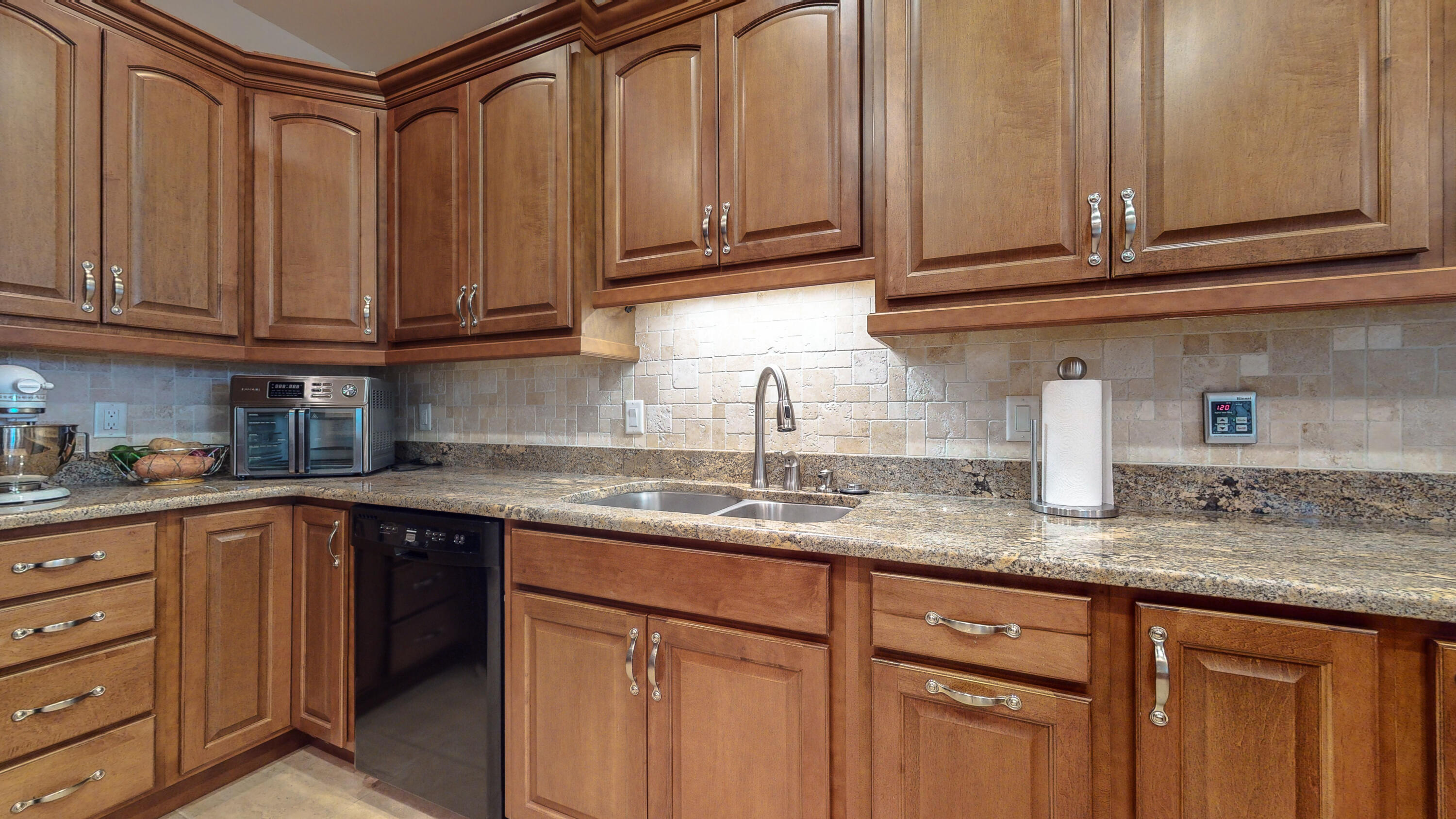 83 Launch Road DeFuniak Springs, FL 32433 - Photo 9 of 62 a kitchen with stainless steel appliances granite countertop a sink and cabinets
