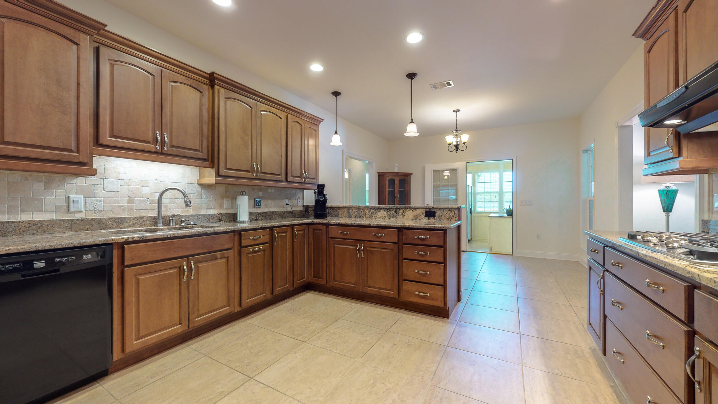 83 Launch Road DeFuniak Springs, FL 32433 - Photo 10 of 62 a kitchen with stainless steel appliances granite countertop a sink stove and cabinets