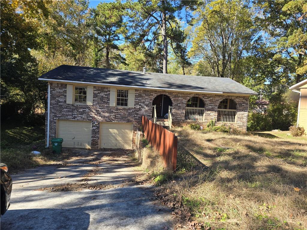 2347 Greenway Drive Decatur, GA 30035 - Photo 1 of 1 a front view of a house with garden