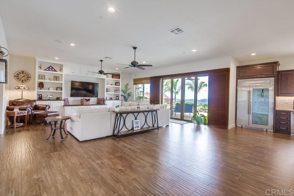 2893 Overland Passage Alpine, CA 91901 - Photo 18 of 51 a living room with furniture kitchen view and a wooden floor