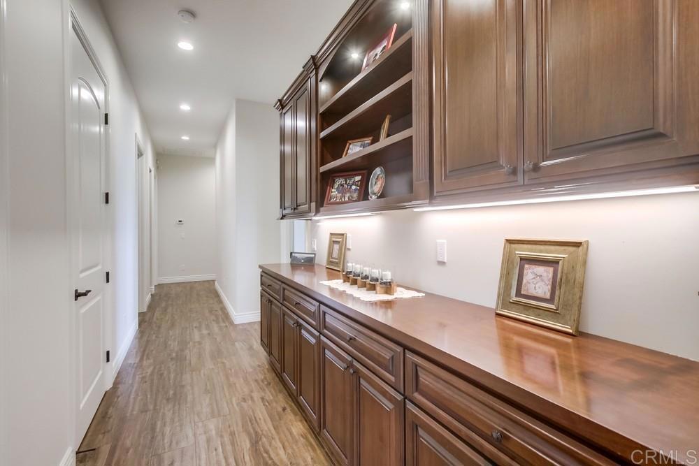 2893 Overland Passage Alpine, CA 91901 - Photo 20 of 51 a kitchen with granite countertop stainless steel appliances and wooden cabinets