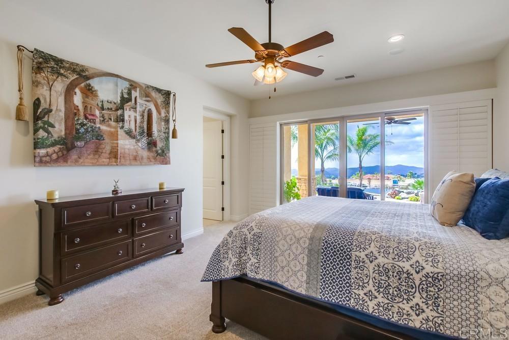 2893 Overland Passage Alpine, CA 91901 - Photo 22 of 51 a bedroom with a bed and large window