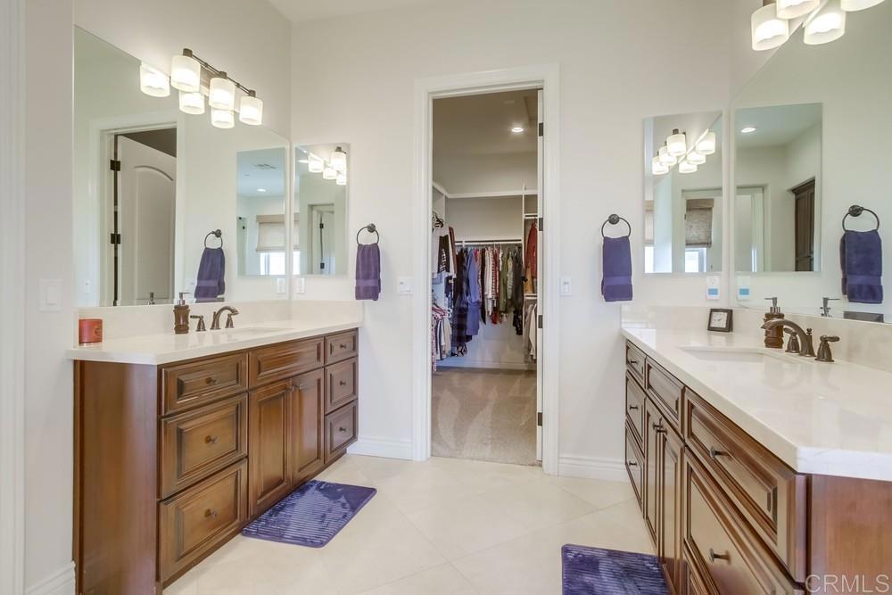 2893 Overland Passage Alpine, CA 91901 - Photo 26 of 51 a spacious bathroom with a double vanity sink a mirror and shower