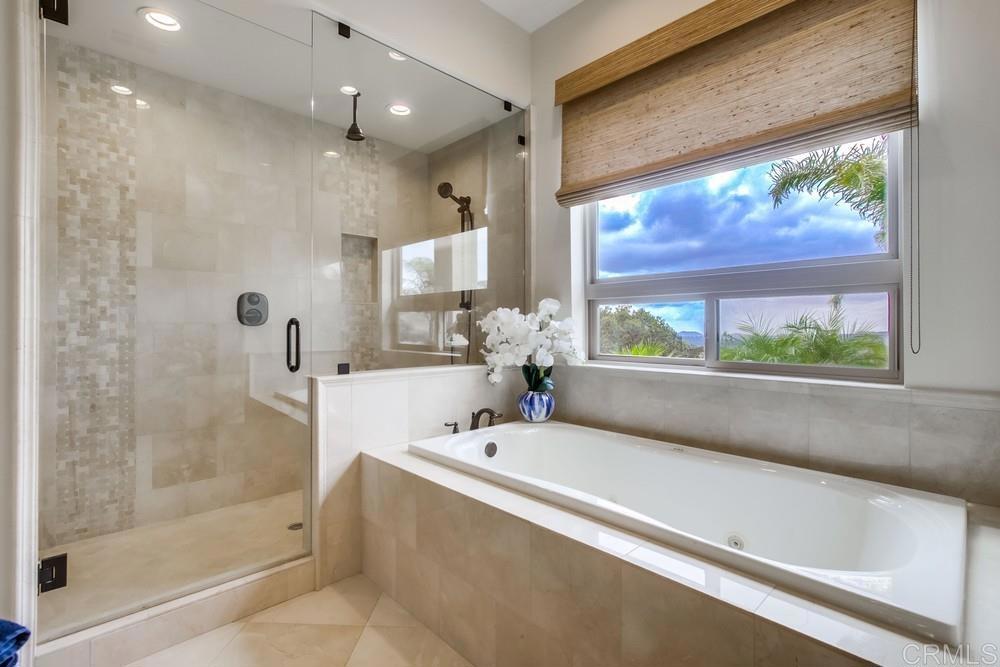 2893 Overland Passage Alpine, CA 91901 - Photo 27 of 51 a bathroom with a bathtub and a shower