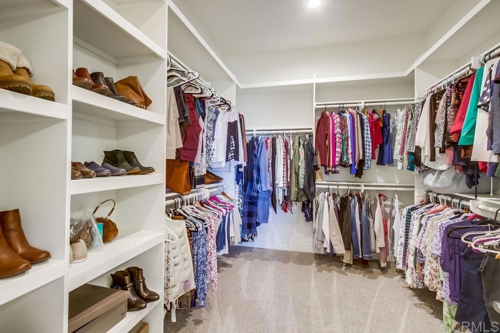 2893 Overland Passage Alpine, CA 91901 - Photo 28 of 51 a view of walk in closet with clothes and shoes
