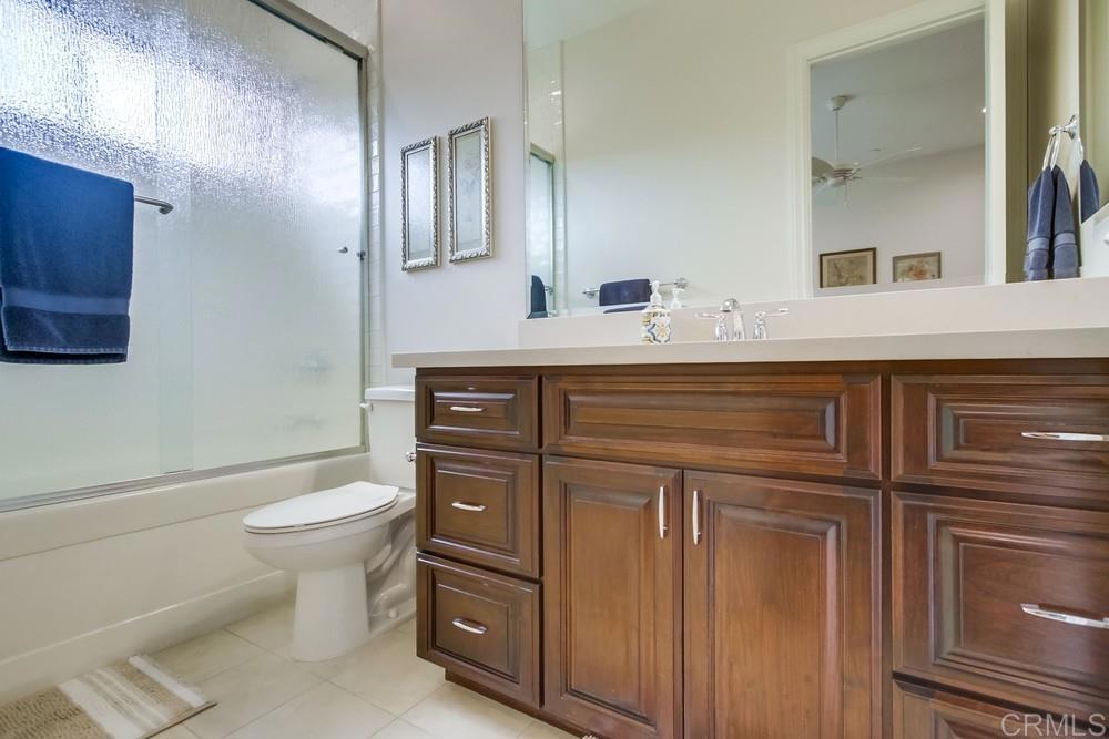 2893 Overland Passage Alpine, CA 91901 - Photo 30 of 51 a bathroom with a sink a toilet and mirror