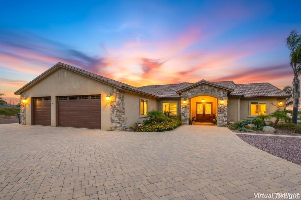 2893 Overland Passage Alpine, CA 91901 - Photo 3 of 51 a front view of a house with a yard and garage