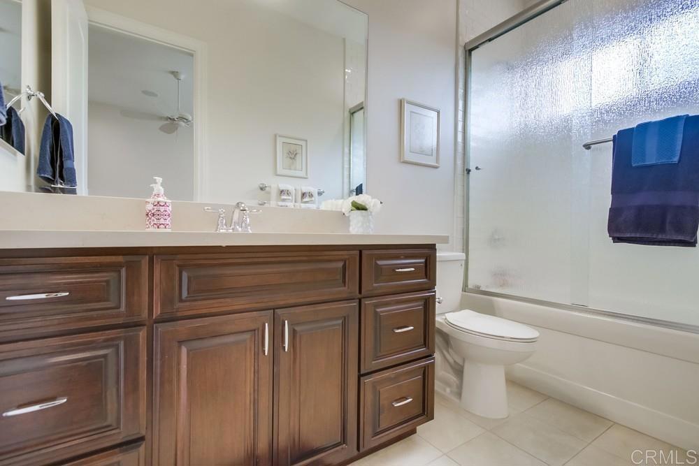 2893 Overland Passage Alpine, CA 91901 - Photo 33 of 51 a bathroom with a toilet sink and mirror
