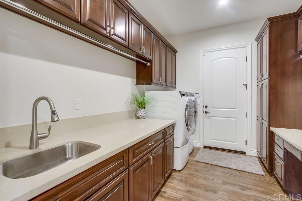 2893 Overland Passage Alpine, CA 91901 - Photo 35 of 51 a kitchen with a sink and a refrigerator