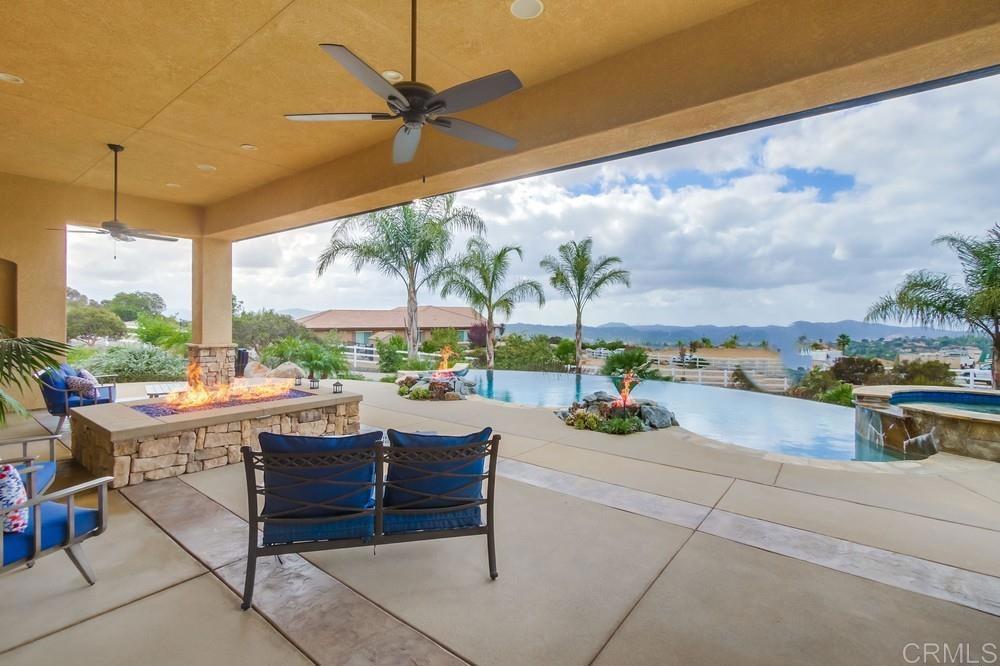 2893 Overland Passage Alpine, CA 91901 - Photo 45 of 51 a view of a patio with a table and chairs