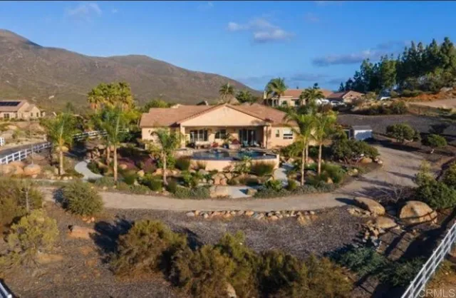 a view of a town with mountains in the background