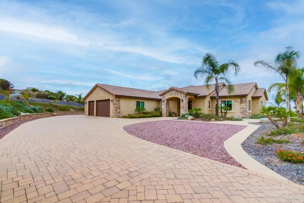 2893 Overland Passage Alpine, CA 91901 - Photo 6 of 51 a front view of a house with a yard and garage