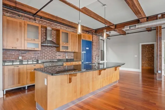 a view of a kitchen with a sink and cabinets