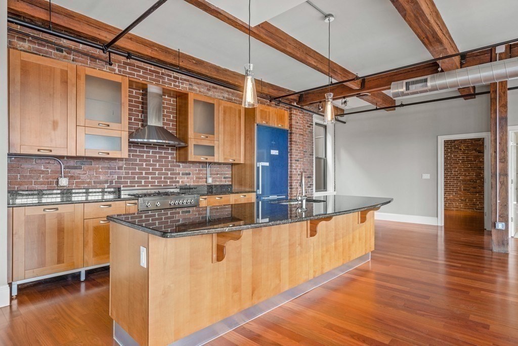 126 North Washington Street, Unit 3 Boston, MA 02114 - Photo 3 of 10 a view of a kitchen with a sink and cabinets