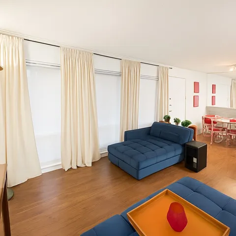 a living room with furniture and a window