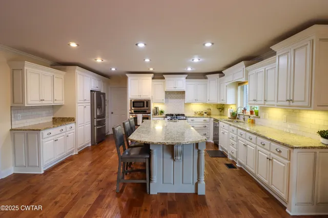 a view of a bedroom with bed and window