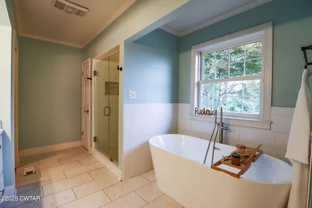a spacious bathroom with a double vanity sink mirror and