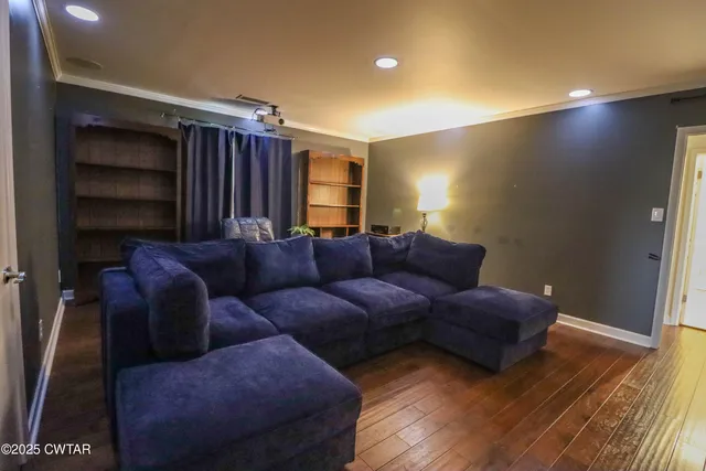 a living room with a couch and a window
