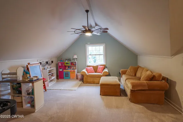 a bathroom with a sink a toilet and a window