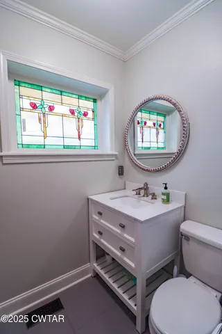 a kitchen with stainless steel appliances granite countertop a table chairs sink refrigerator and cabinets