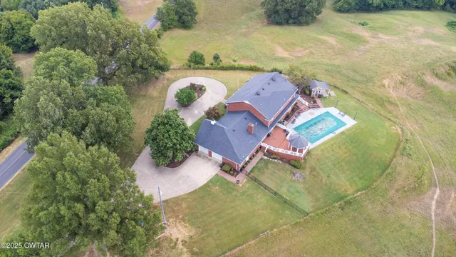 an aerial view of residential house with outdoor space