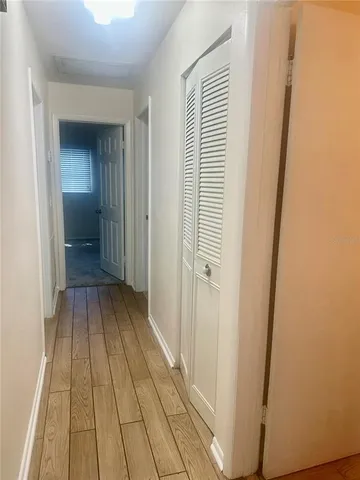 a view of a bedroom from a hallway