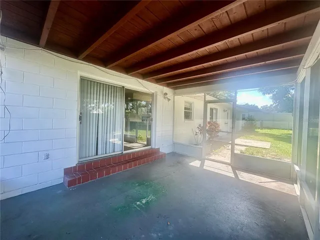 a view of an empty room and window