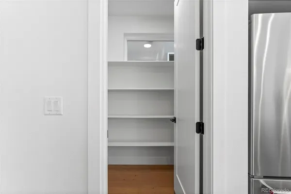 a living room with furniture a potted plant and a fireplace