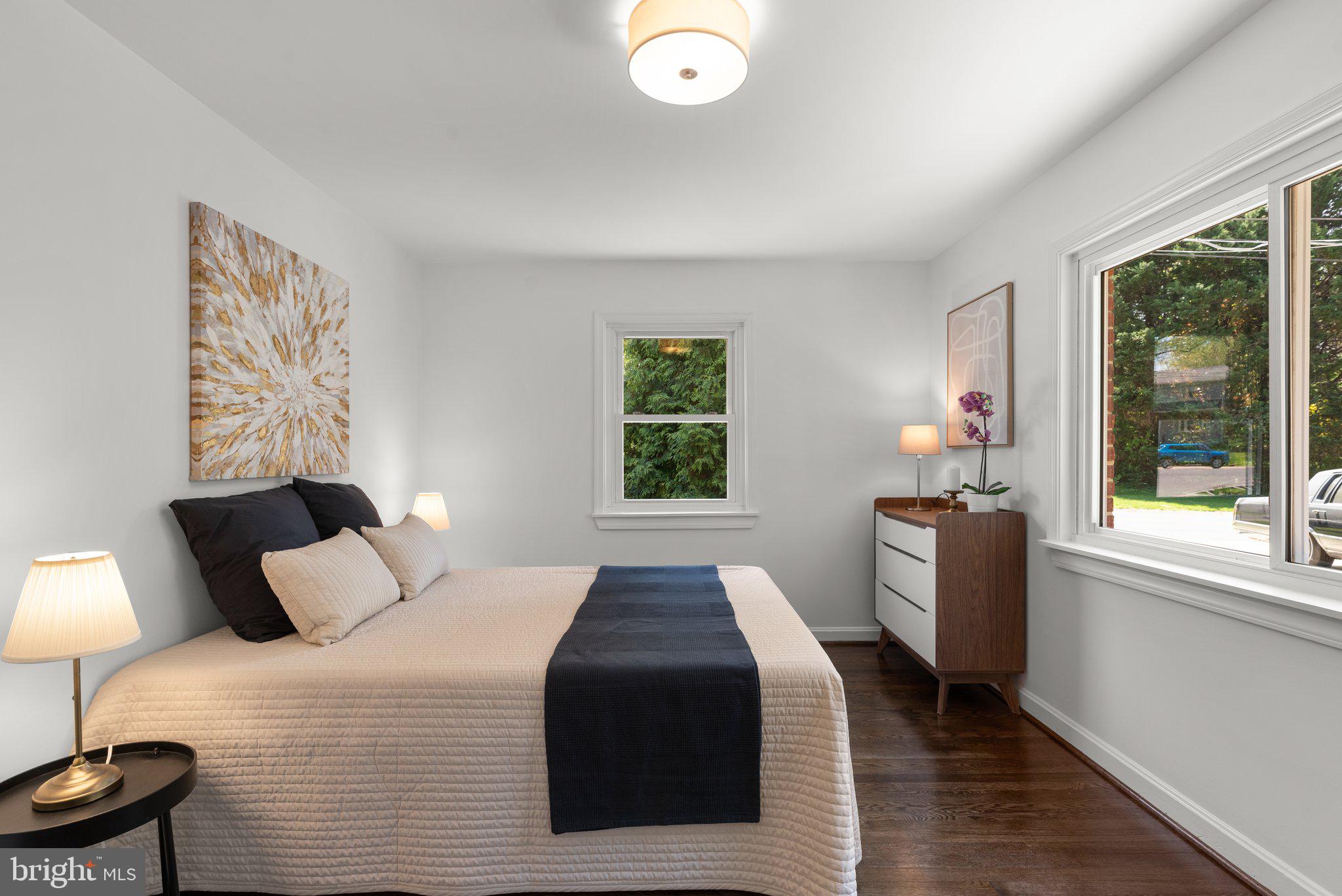 10126 Renfrew Road Silver Spring, MD 20901 - Photo 16 of 40 a bedroom with a bed and a large window