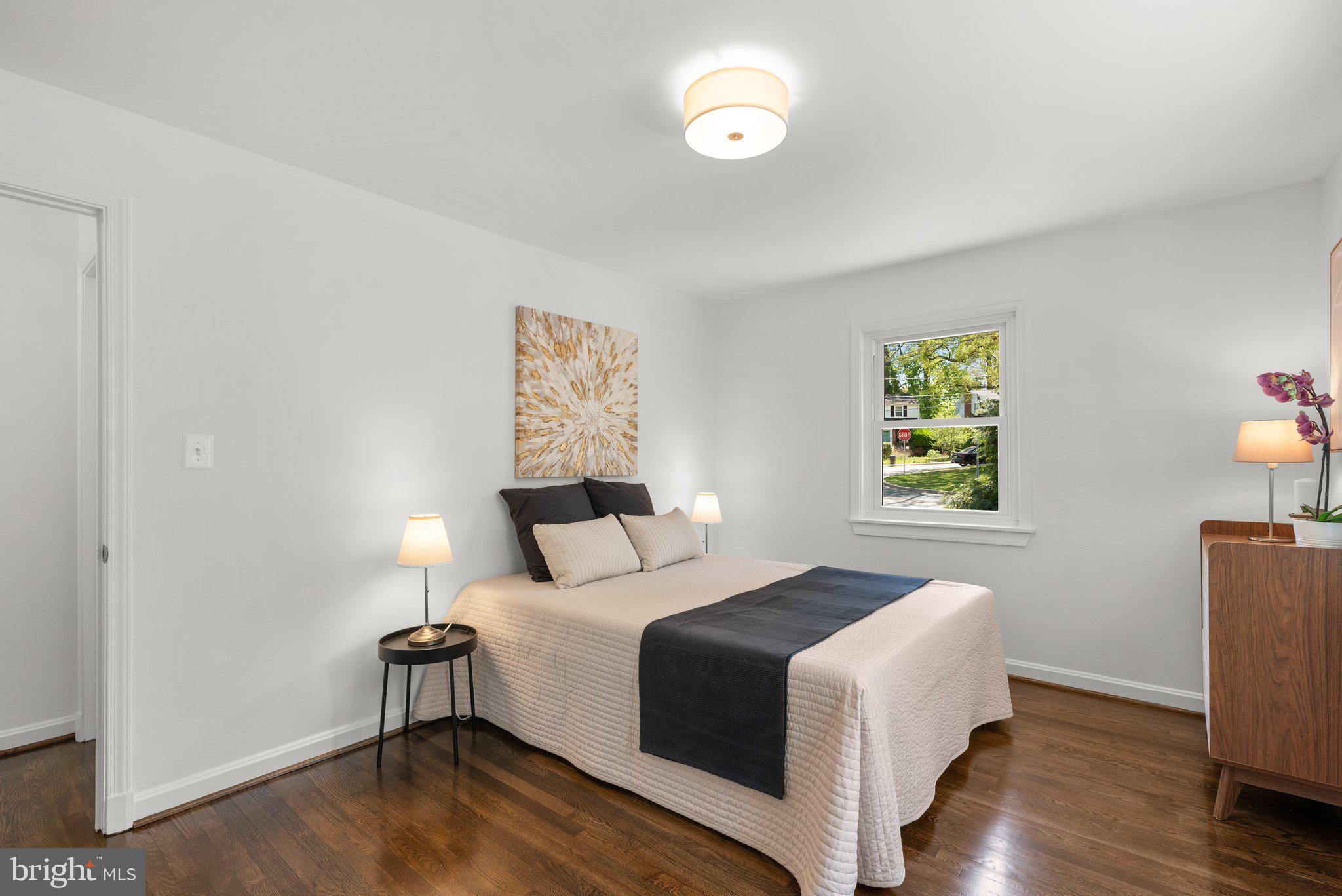 10126 Renfrew Road Silver Spring, MD 20901 - Photo 17 of 40 a bedroom with a bed and a window