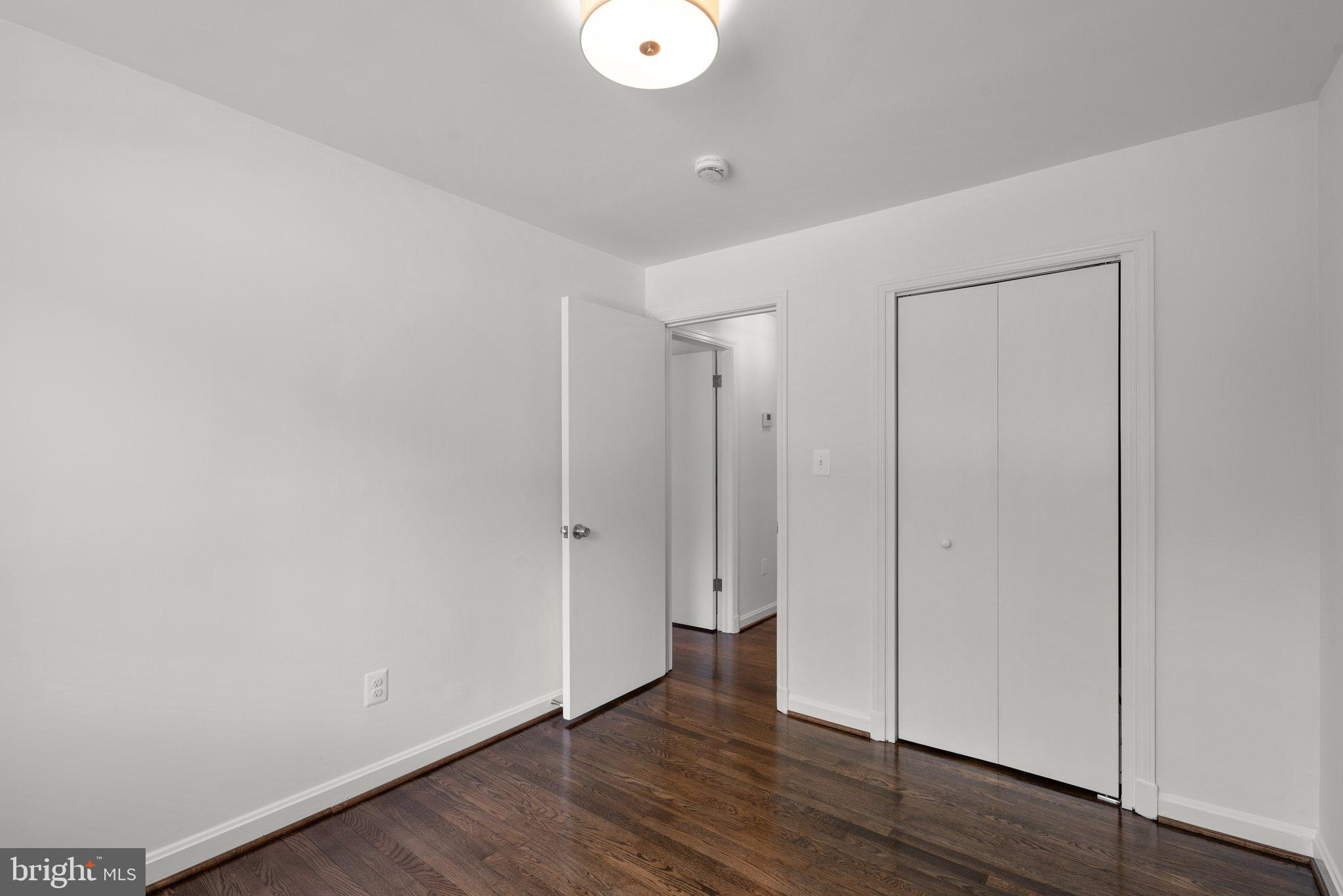 10126 Renfrew Road Silver Spring, MD 20901 - Photo 19 of 40 a view of an empty room with wooden floor