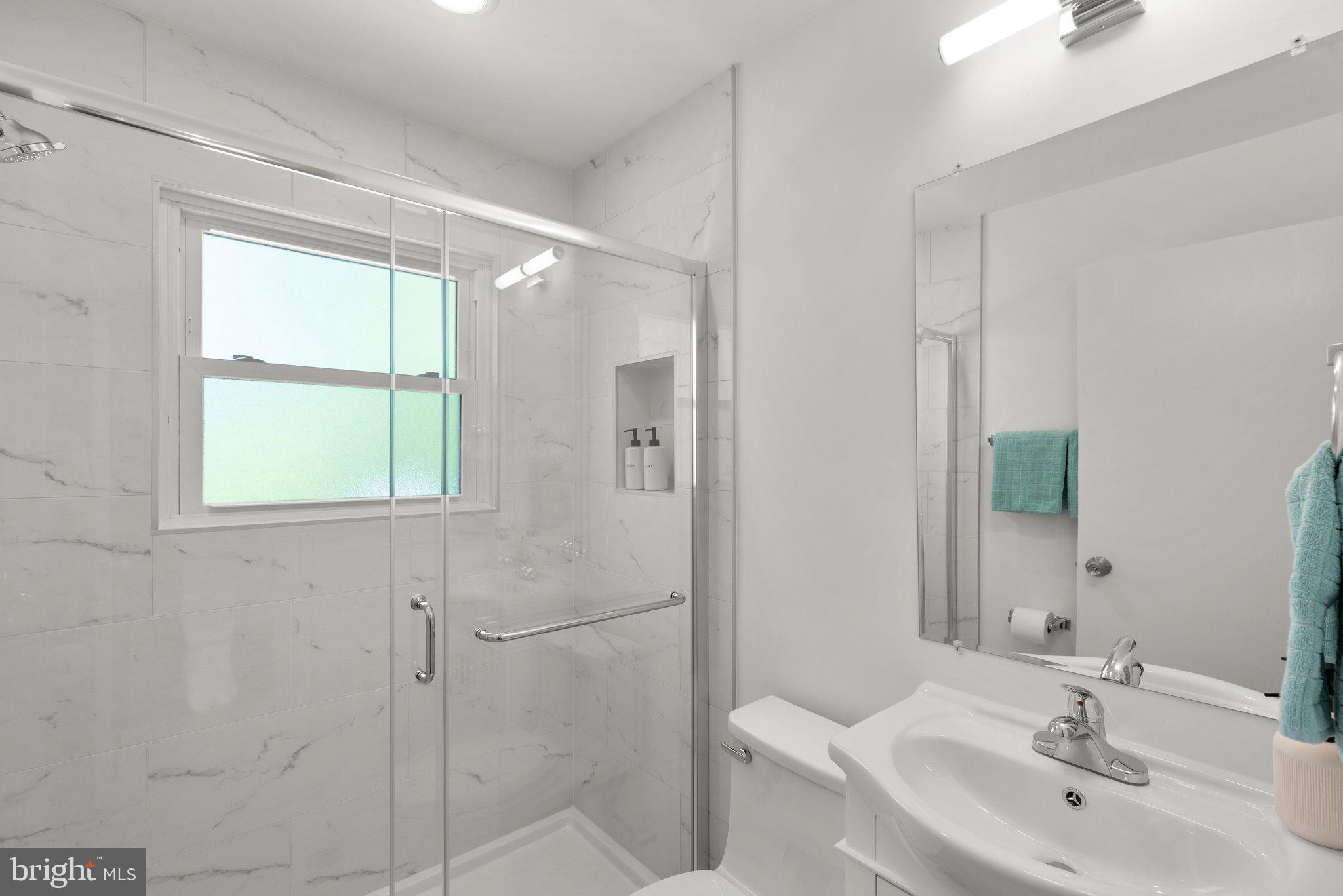 10126 Renfrew Road Silver Spring, MD 20901 - Photo 22 of 40 a bathroom with a sink toilet and shower