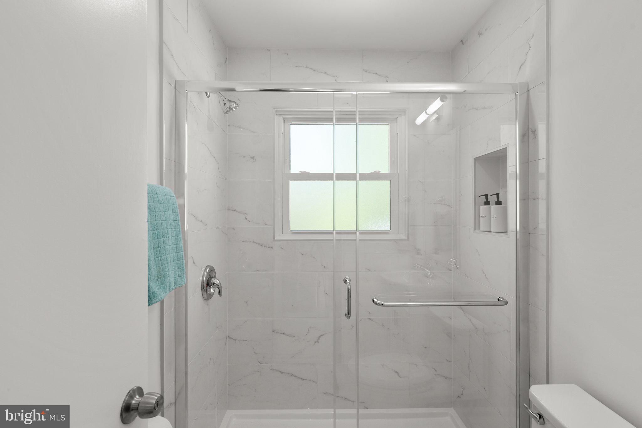 10126 Renfrew Road Silver Spring, MD 20901 - Photo 23 of 40 a bathroom with a shower and a toilet