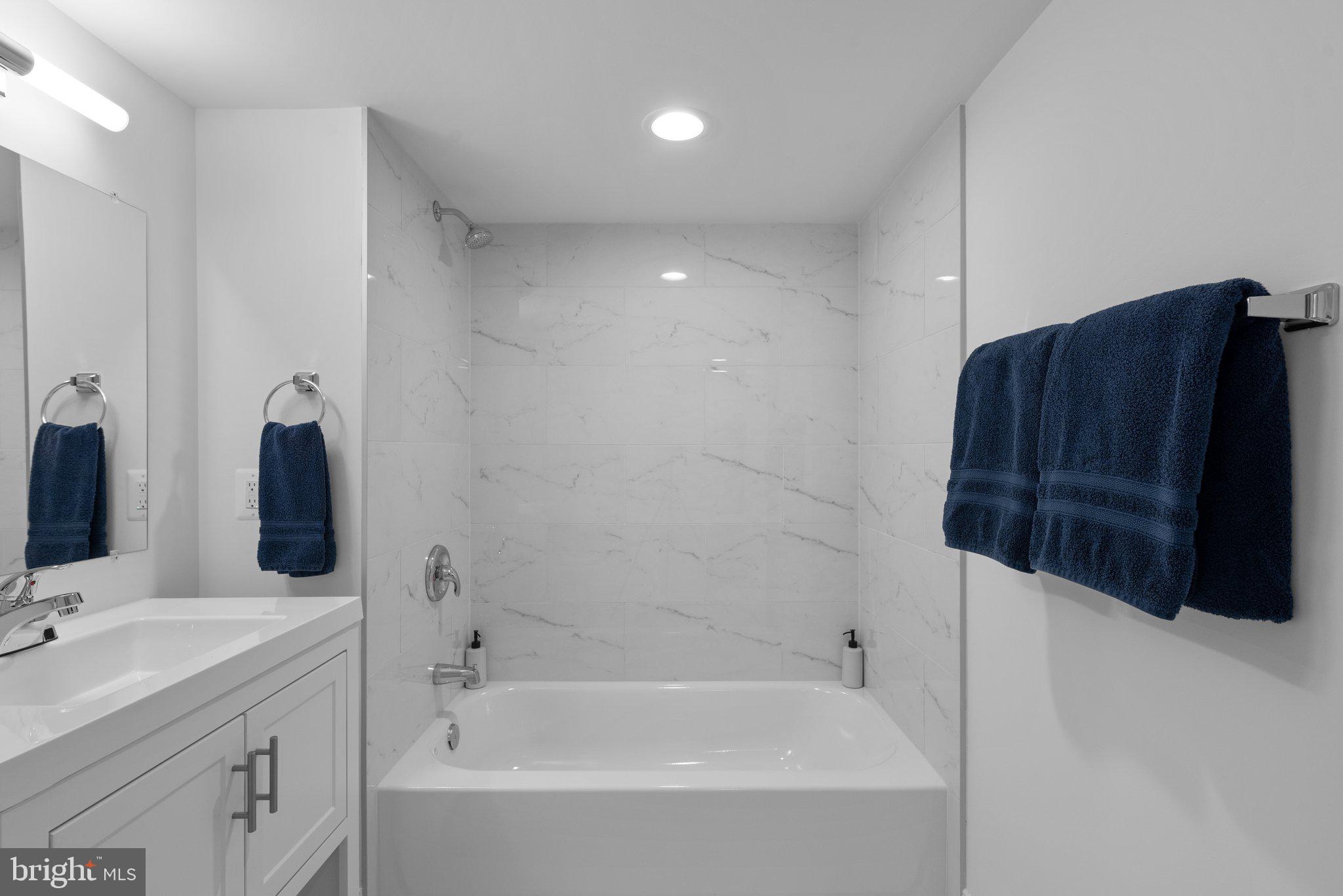 10126 Renfrew Road Silver Spring, MD 20901 - Photo 32 of 40 a bathroom with a bathtub and a sink