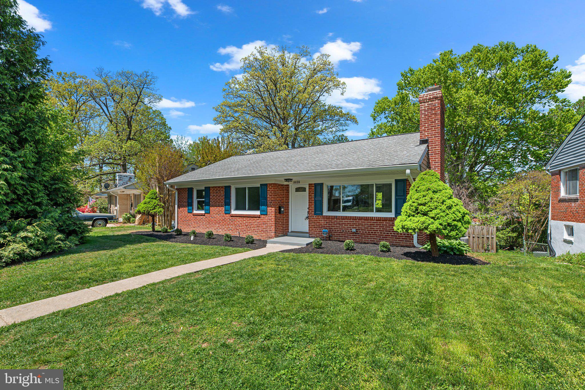 10126 Renfrew Road Silver Spring, MD 20901 - Photo 37 of 40 a front view of a house with a yard porch and sitting area