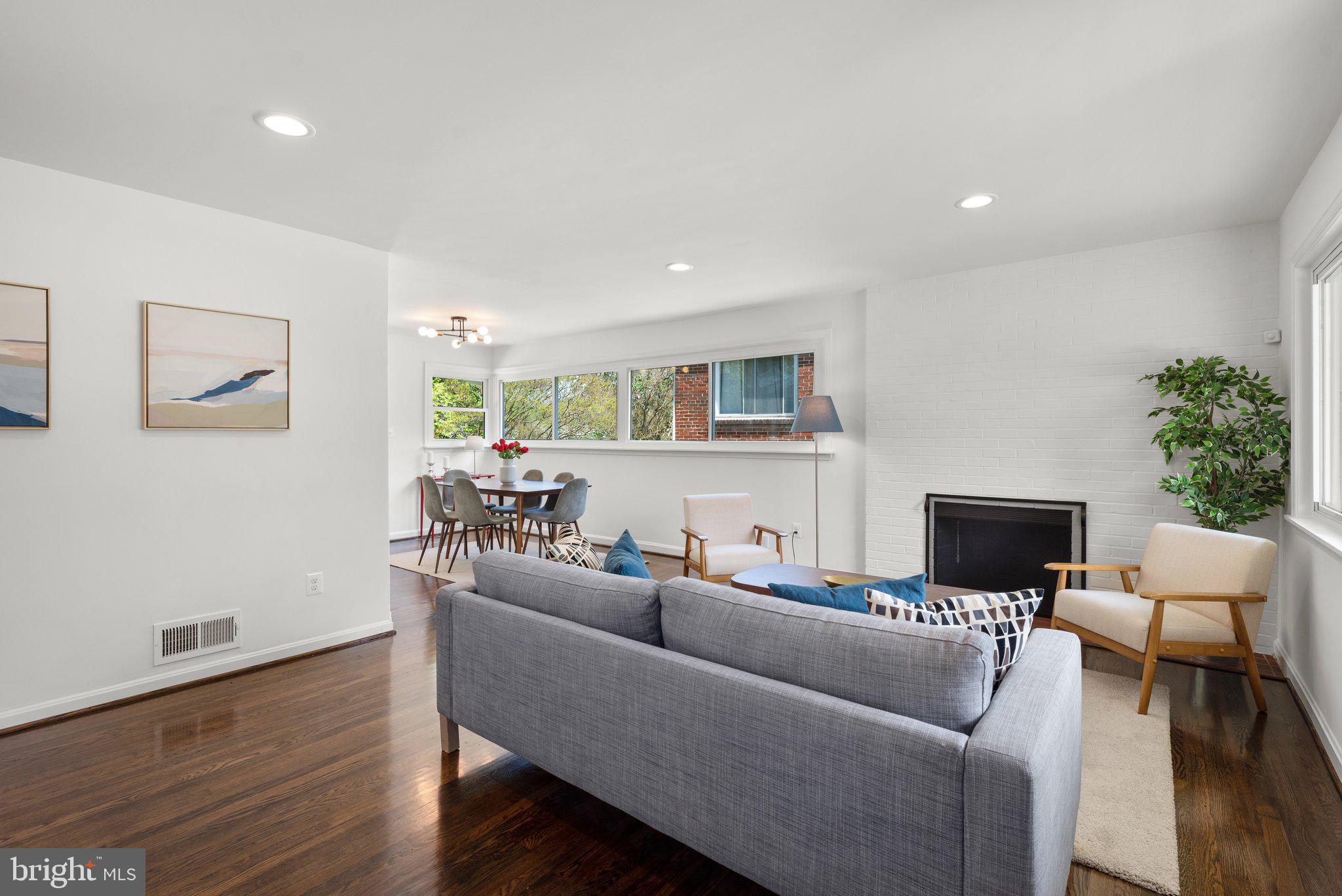 10126 Renfrew Road Silver Spring, MD 20901 - Photo 6 of 40 a living room with furniture and a flat screen tv